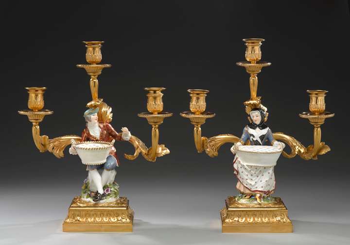 A pair of three branch candelabra with 'bouquetière' figures